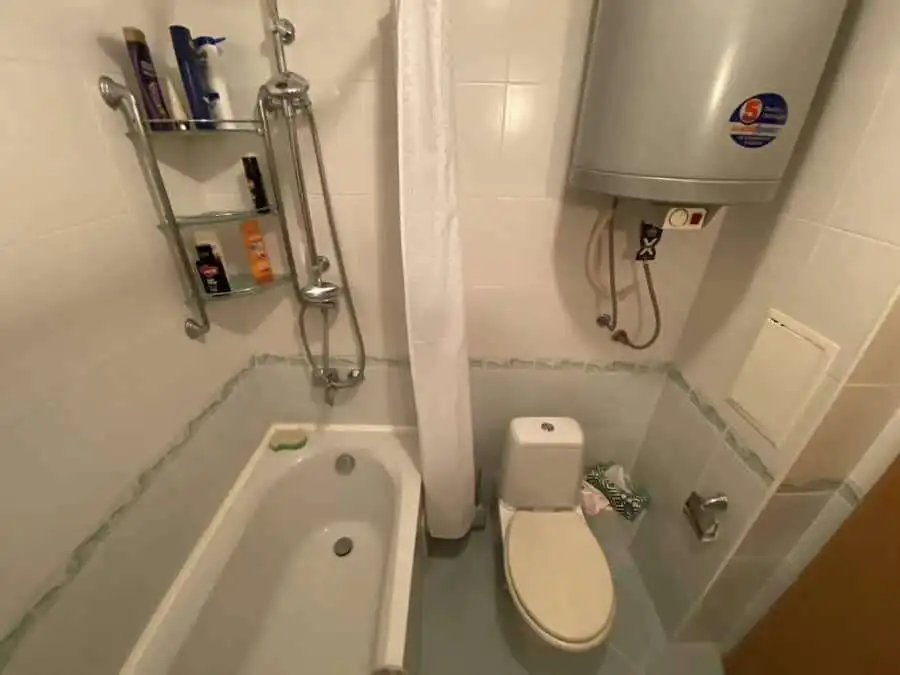 Bathroom with bathtub, shower, and water heater in Vineyards SPA Resort.