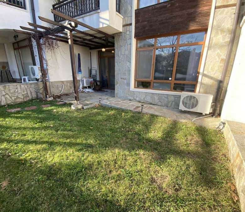 Bright outdoor garden space of a 1-bedroom apartment near the sea.