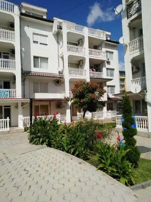Bright white 2-bedroom apartment with balcony and garden in Sunny Beach center.