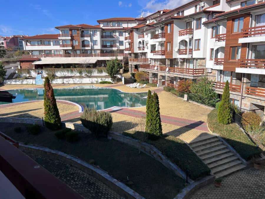 View of Gardenia Hills residential complex with swimming pool and landscaped gardens near Sunny Beac.