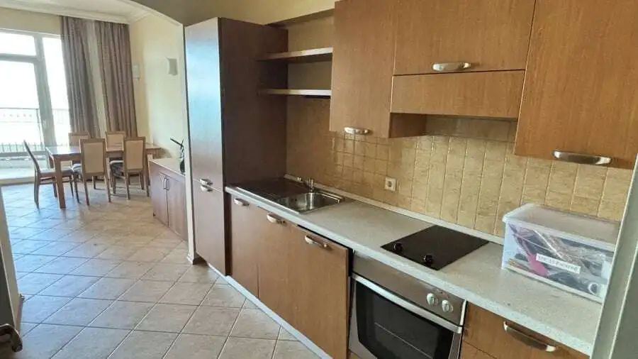 Interior view of a modern kitchen in a beachfront Sunset Resort apartment, Pomorie.