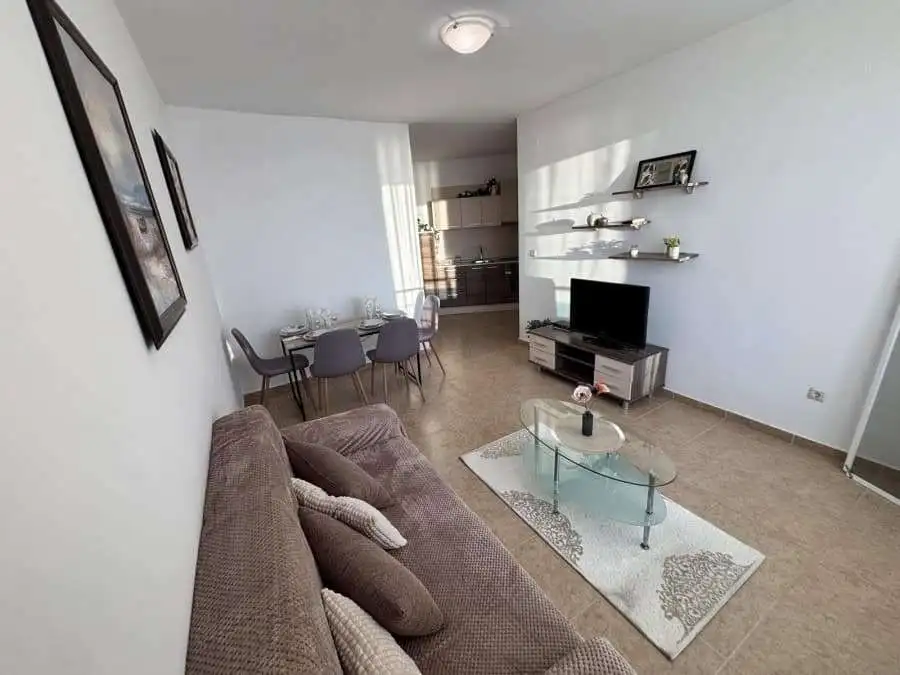 Bright living room with sea views and modern furnishings.