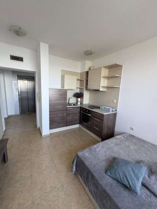 Sea front spacious studio, 42 sq.m., in Costa Calma Ravda, featuring a compact kitchen and cozy slee.