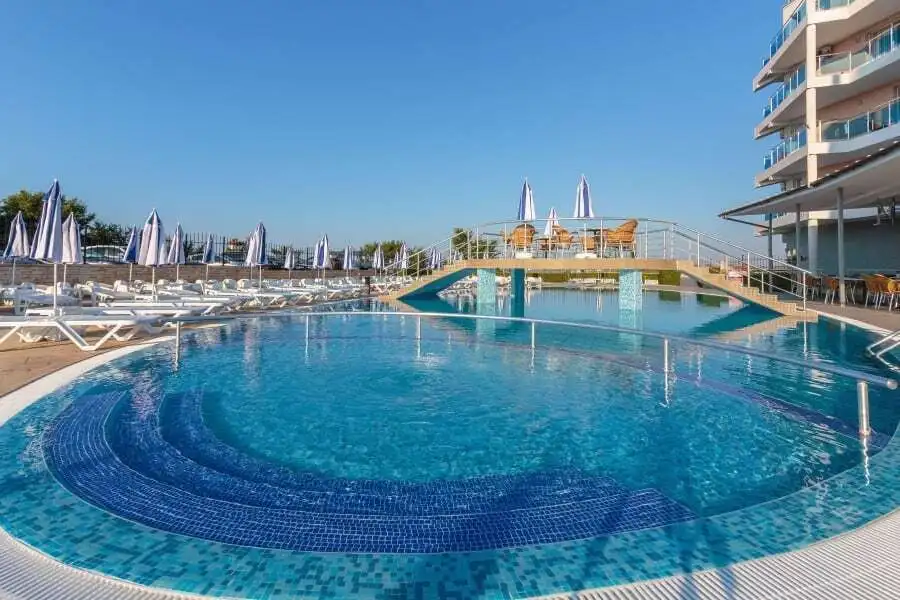 Sea view pool with sun loungers and umbrellas in Costa Calma, Ravda.