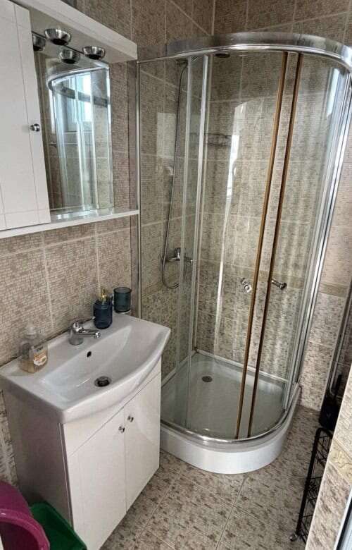 Compact bathroom with shower in Costa Calma studio apartment.
