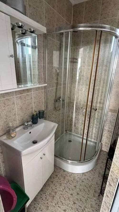 Compact bathroom with shower in Costa Calma studio apartment.