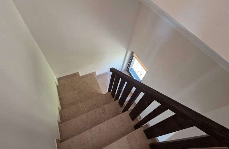 Staircase leading to the upper floor of a maisonette in Bay View Villas, Kosharitsa, Bulgaria.