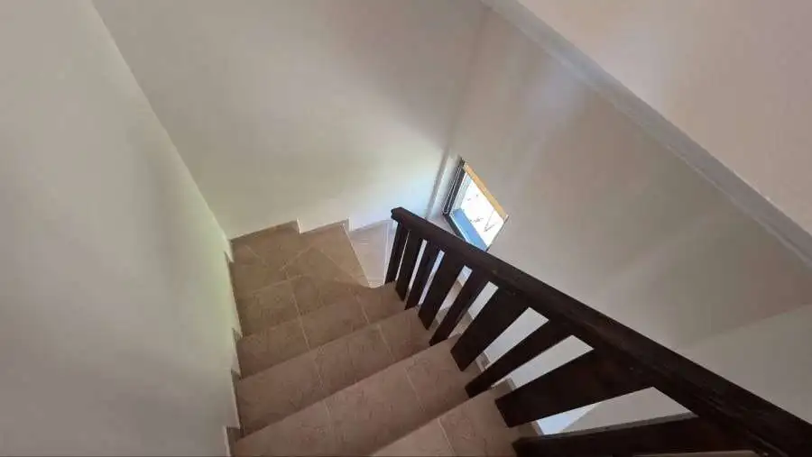 Staircase leading to the upper floor of a maisonette in Bay View Villas, Kosharitsa, Bulgaria.