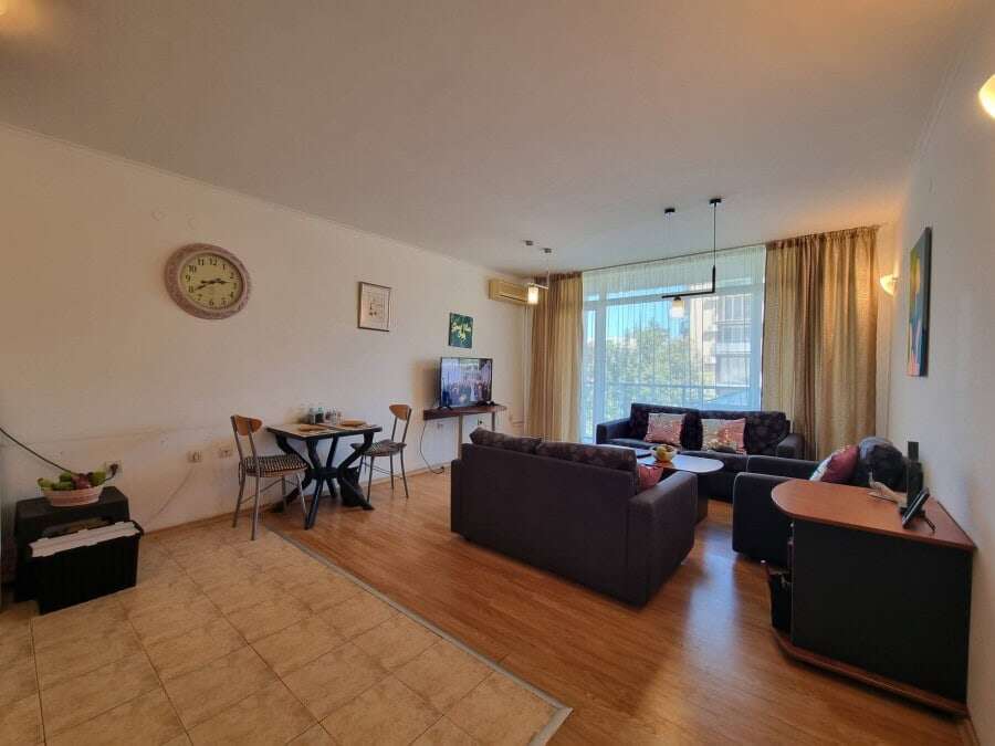 Comfortable living room with large windows and seating area in Prima 1, Sunny Beach.