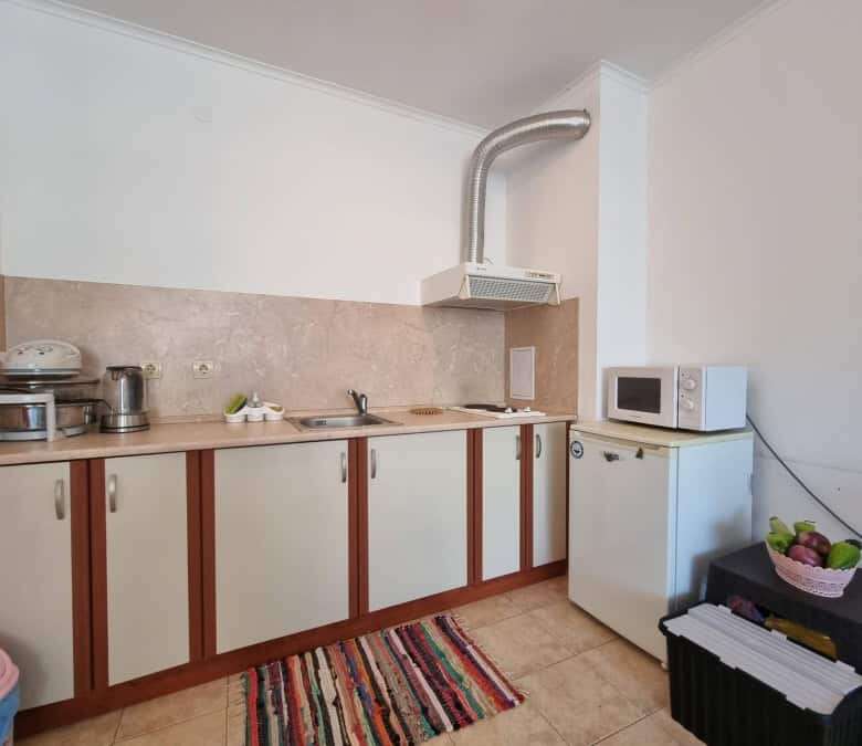 Kitchen with appliances, microwave, and small fridge in Prima 1, Sunny Beach.