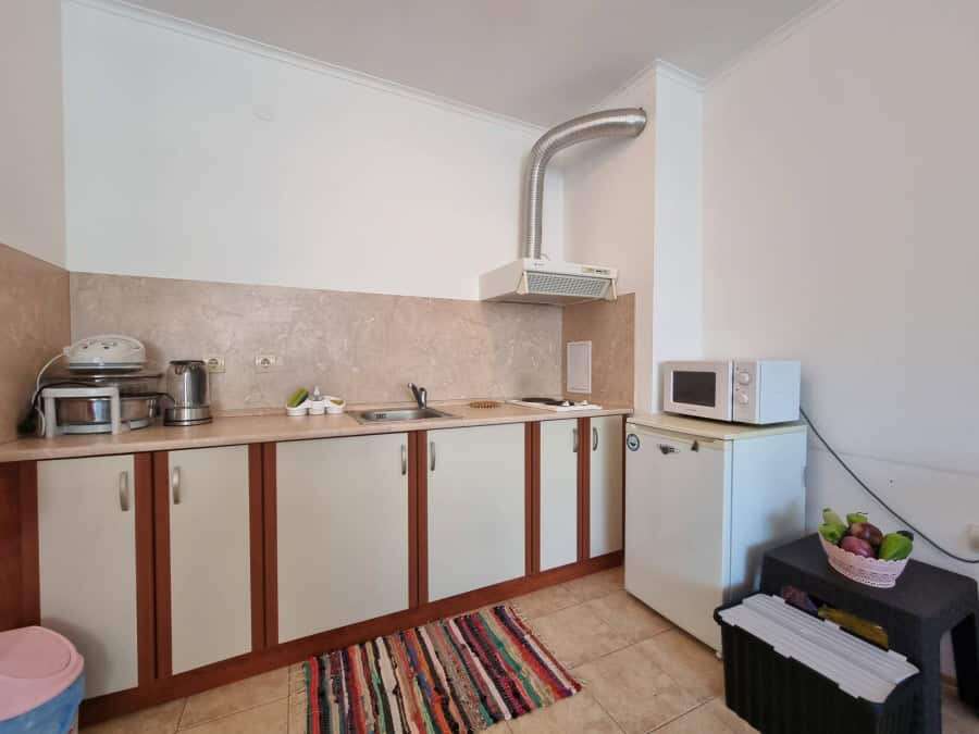 Kitchen with appliances, microwave, and small fridge in Prima 1, Sunny Beach.