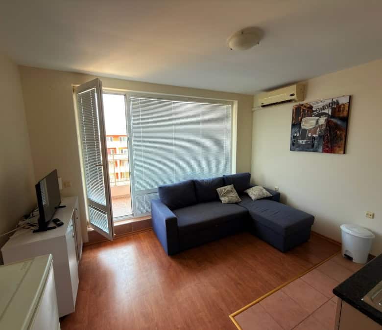 Apartment with living room, sofa, and balcony in Sunny Beach.