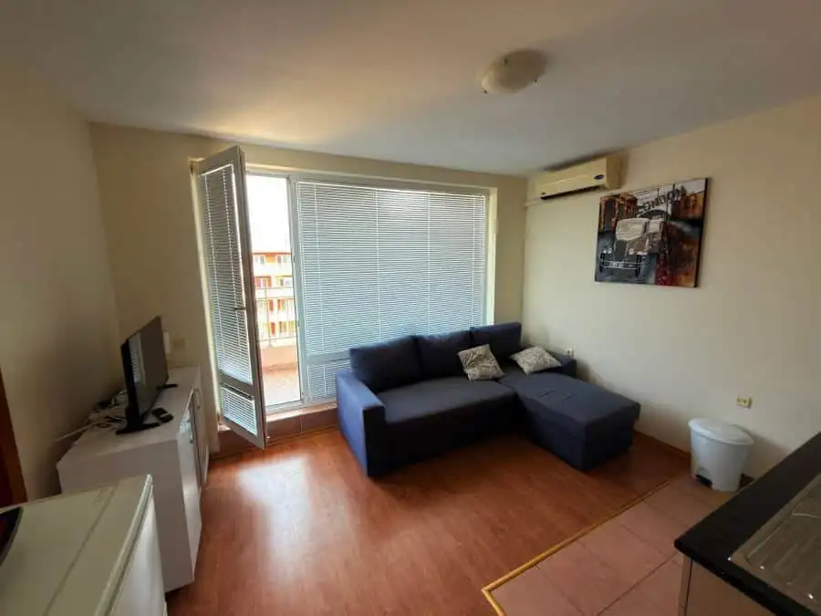 Apartment with living room, sofa, and balcony in Sunny Beach.