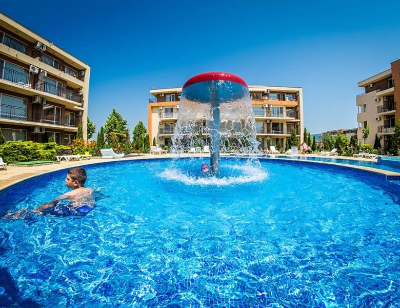 Bright outdoor pool with water fountain at Nessebar Fort club, Sunny Beach.