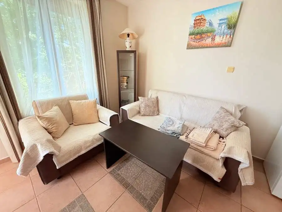 Bright living room with comfortable sofas and natural light in Sunny Beach.