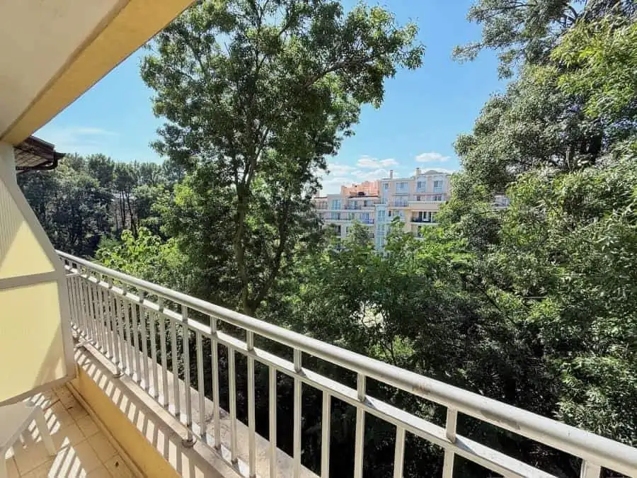 Balcony view of lush greenery and nearby buildings at Summer Dreams, Sunny Beach.