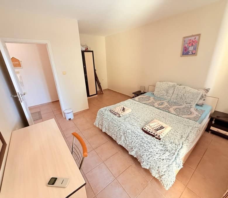 Interior view of a fully furnished bedroom in Summer Dreams, Sunny Beach resort, with a double bed a.