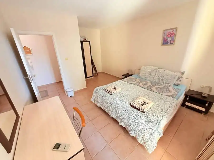 Interior view of a fully furnished bedroom in Summer Dreams, Sunny Beach resort, with a double bed a.