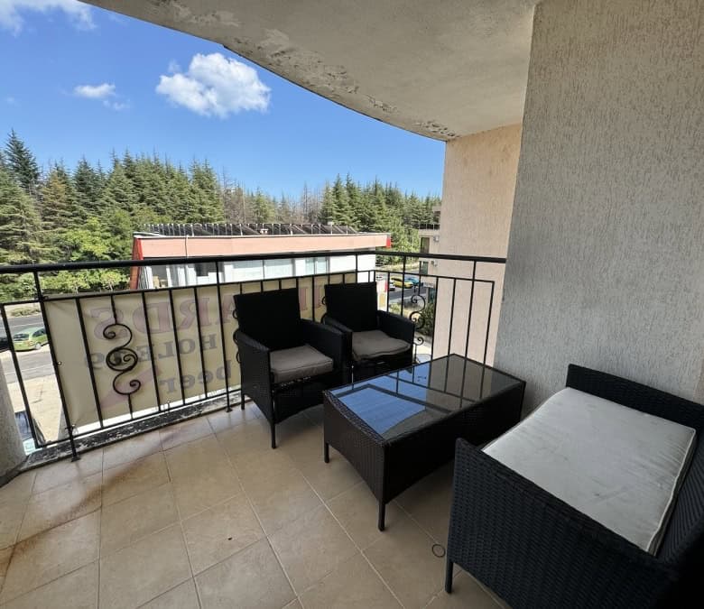 Balcony view of Avalon Sunny Beach with outdoor seating area.