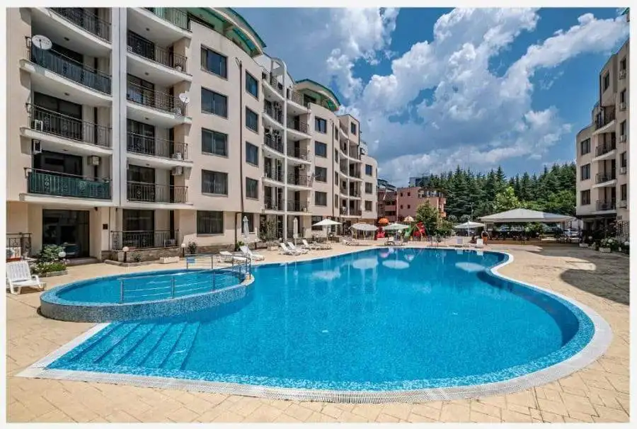 Bright outdoor swimming pool at Avalon Sunny Beach residential complex.