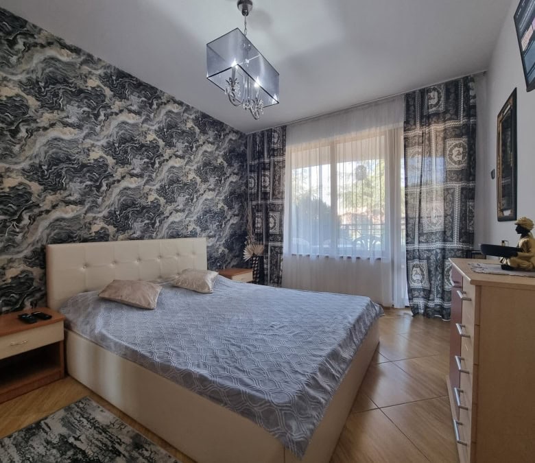 Elegant bedroom with stylish decor and large window in Golden Dreams, Sunny Beach.
