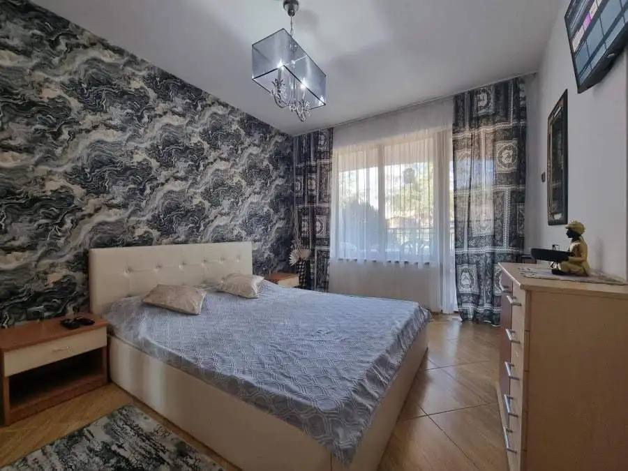 Elegant bedroom with stylish decor and large window in Golden Dreams, Sunny Beach.