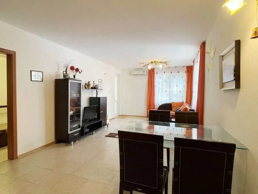 Bright, spacious living room with contemporary furniture and large windows.