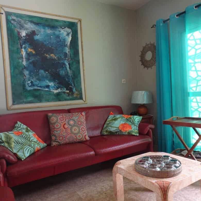 Bedroom bed and breakfast for sale in Kombo North district, featuring vibrant decor and inviting liv.