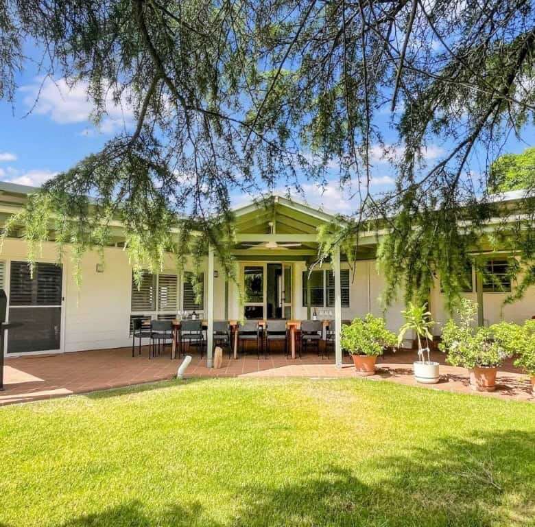 Vineyard estate featuring two stunning homes for sale in Broke, surrounded by lush greenery and scen.