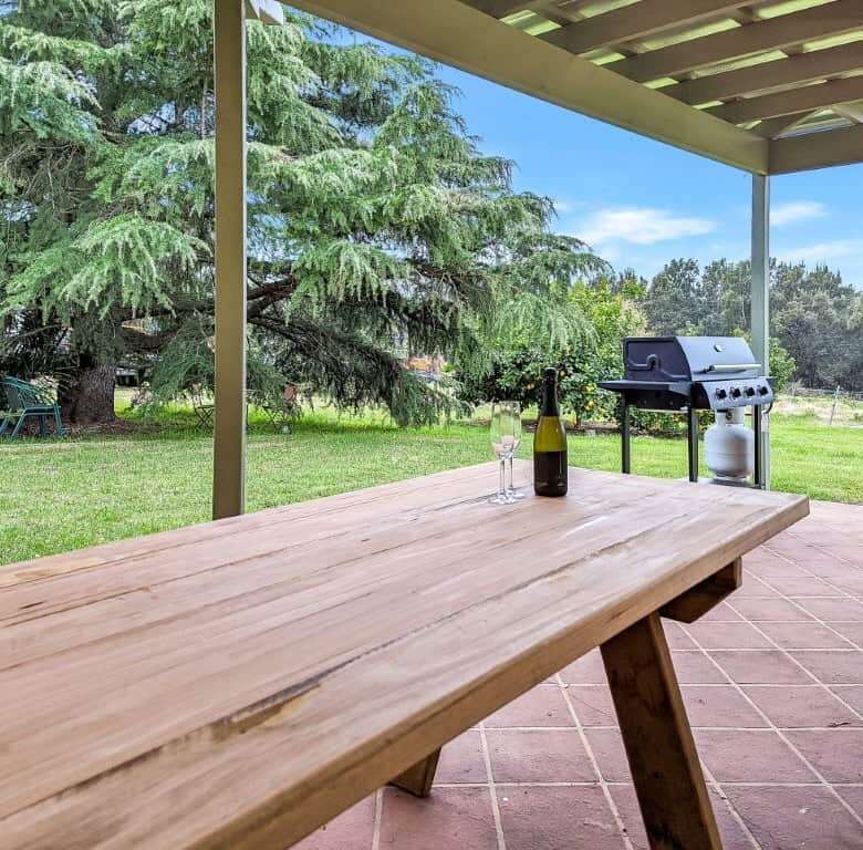 Vineyard estate featuring a spacious outdoor patio with a BBQ grill and scenic views in Broke.