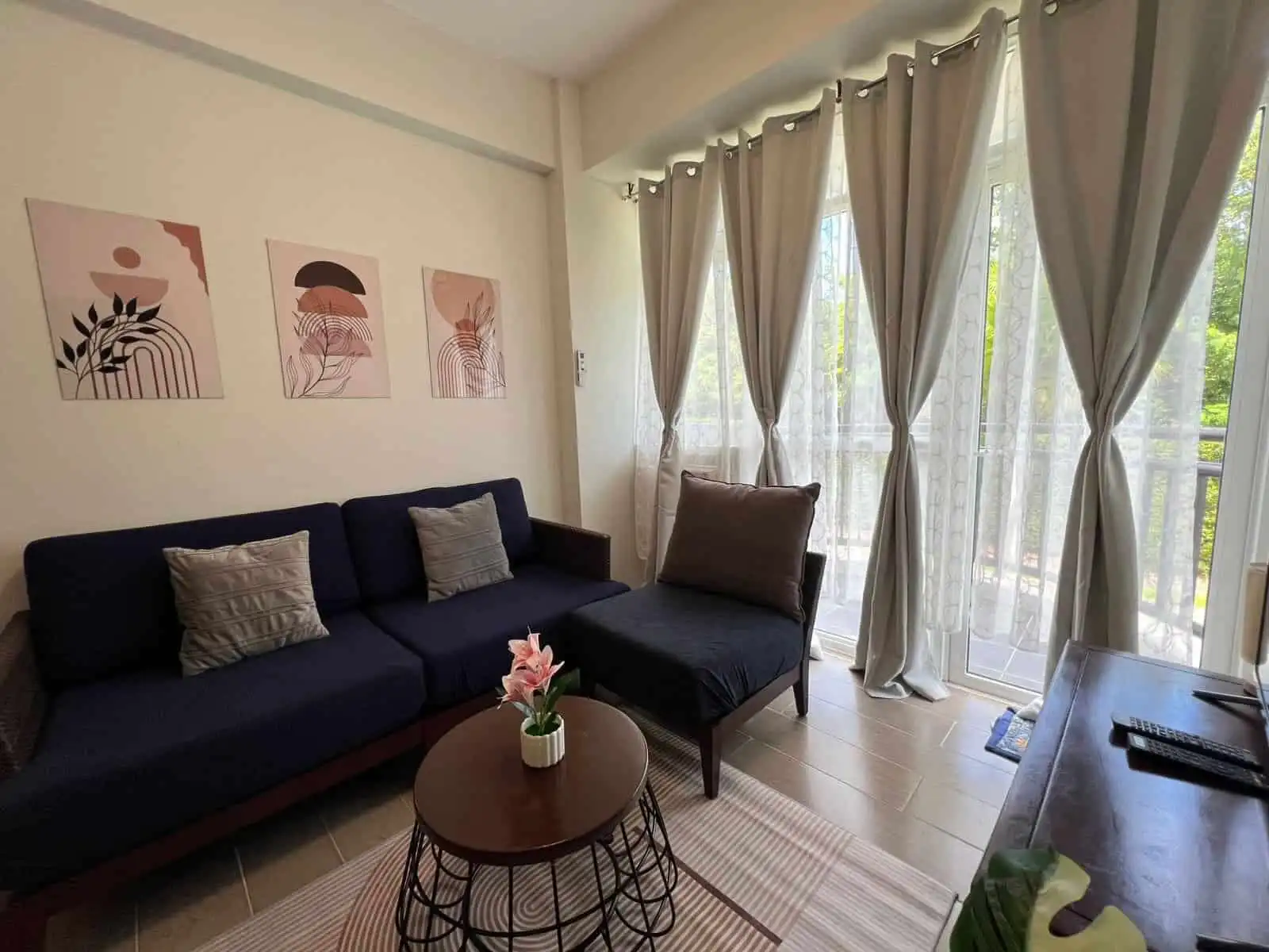 Spacious living room with natural light, stylish decor, and balcony views in Oceanway Residencies Bo.