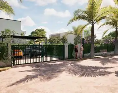 Gated entrance to RH Palmeraie Resort with lush palm trees in Ngaparou Saly.
