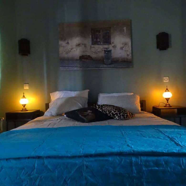 Interior view of a cozy six-bedroom bed and breakfast in Kombo North district, featuring warm lighti.