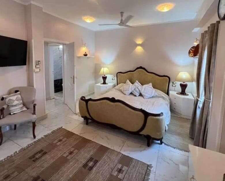 Elegant bedroom in Derrymore Glen estate, County Clare, with classic furnishings and cozy ambiance.