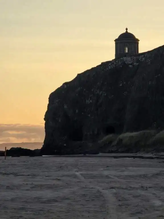 Beautiful coastal fortress overlooking the sea at sunset in Castlerock, County Derry, Northern Irela.