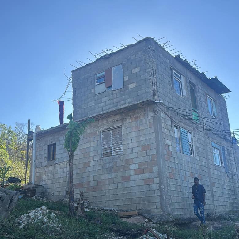 Unfinished multi-story building on a 1-acre plot in Rose Hall Estate, Montego Bay.