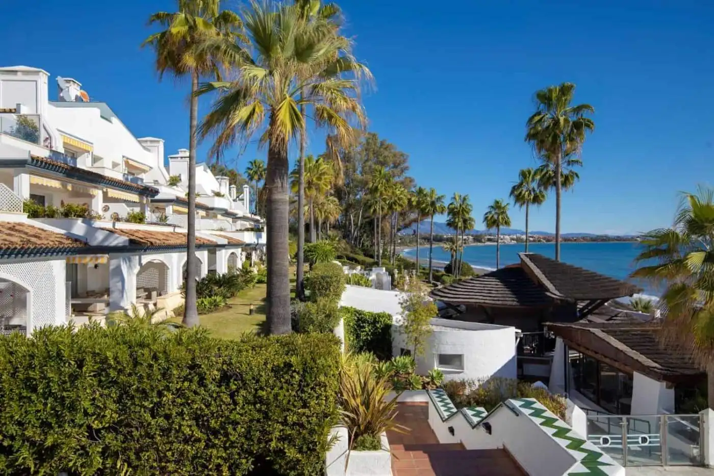 Stunning beachfront villa with lush gardens and ocean views in Dominion Beach. Perfect investment op.