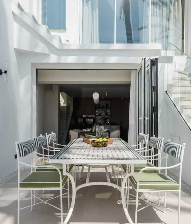 Outdoor dining space at exclusive Marbella beachfront property.