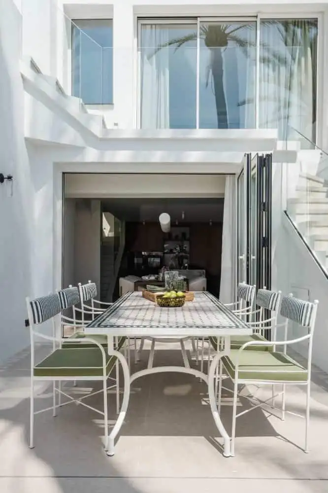 Outdoor dining space at exclusive Marbella beachfront property.