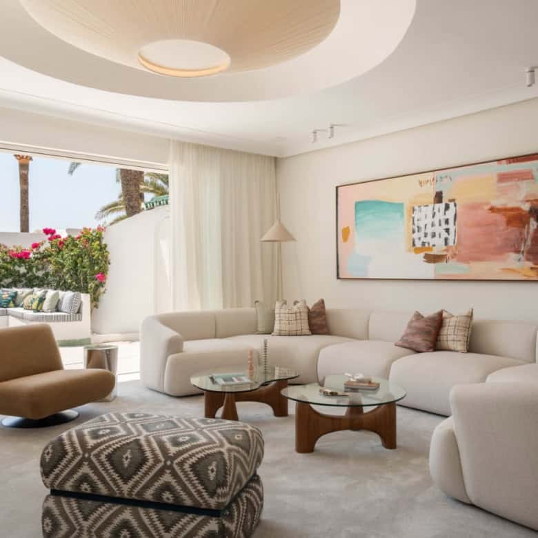 Beachfront semi-detached home in Marbella's Golden Mile with modern interior and ocean views.