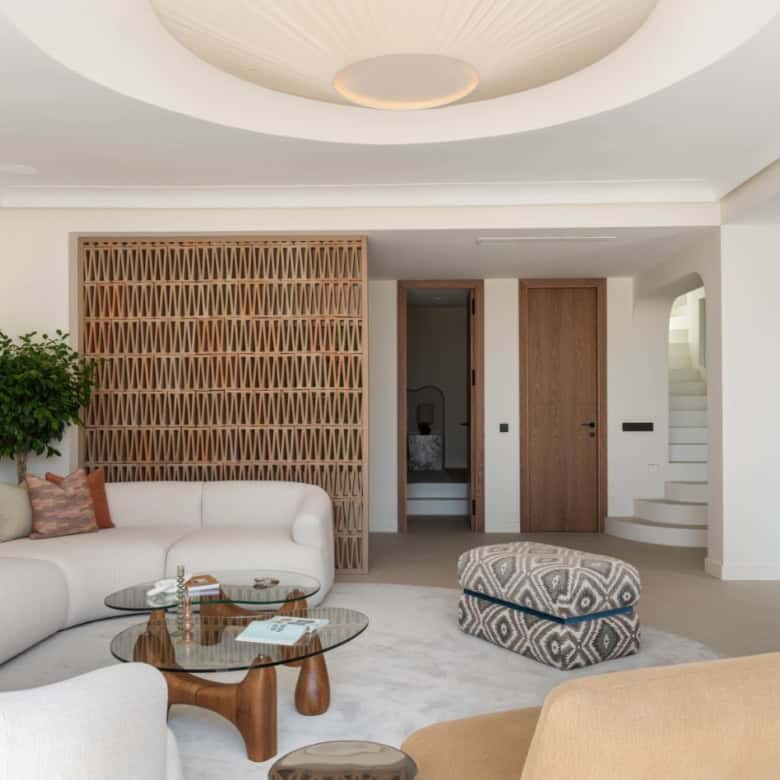 Elegant beachfront semi-detached home in Marbella's Golden Mile with modern interiors.