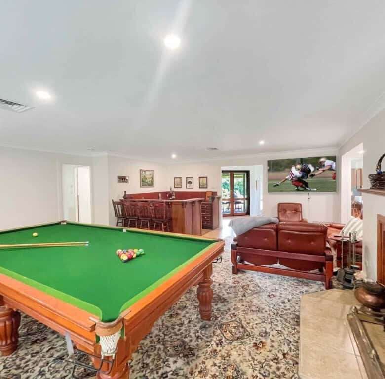Vineyard estate featuring a billiards table, cozy seating area, and fireplace in Broke. Perfect for.