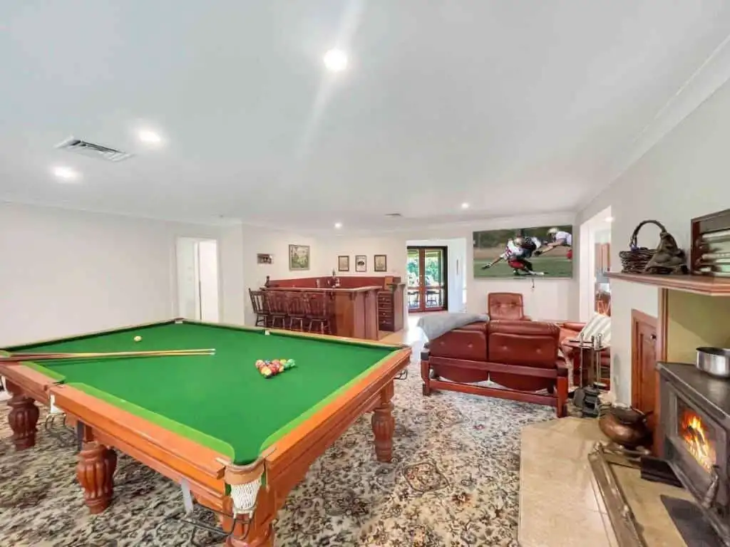Vineyard Estate with Two Homes for Sale in Broke Vineyard estate featuring a billiards table, cozy seating area, and fireplace in Broke. Perfect for.