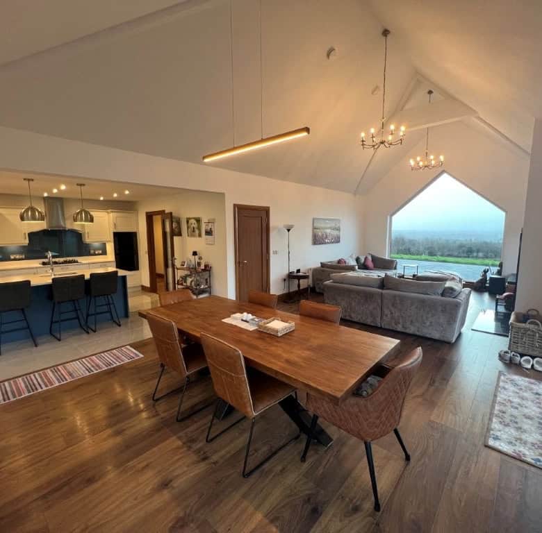 Spacious living area with panoramic views and modern decor.