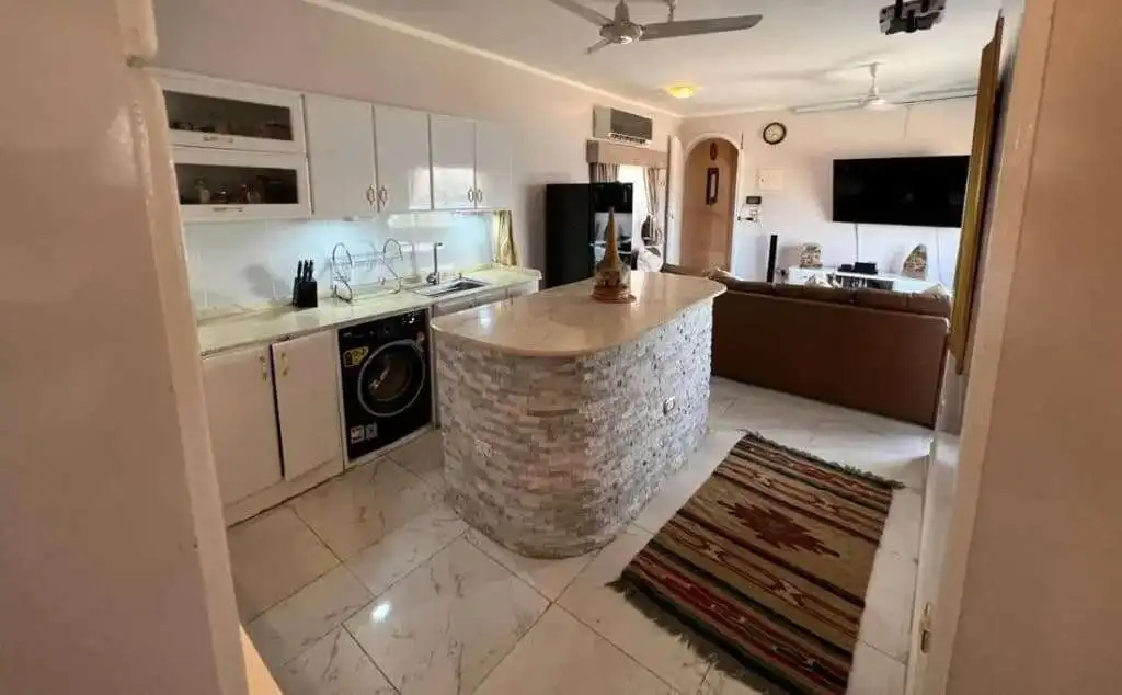 Modern kitchen with island in Derrymore Glen estate, County Clare.
