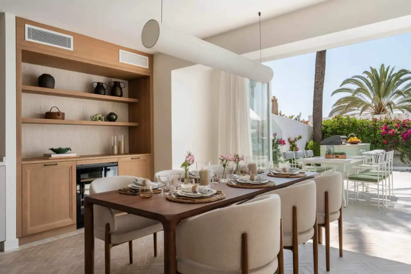 Beachfront semi-detached home with stylish interior and outdoor terrace in Marbella Golden Mile.