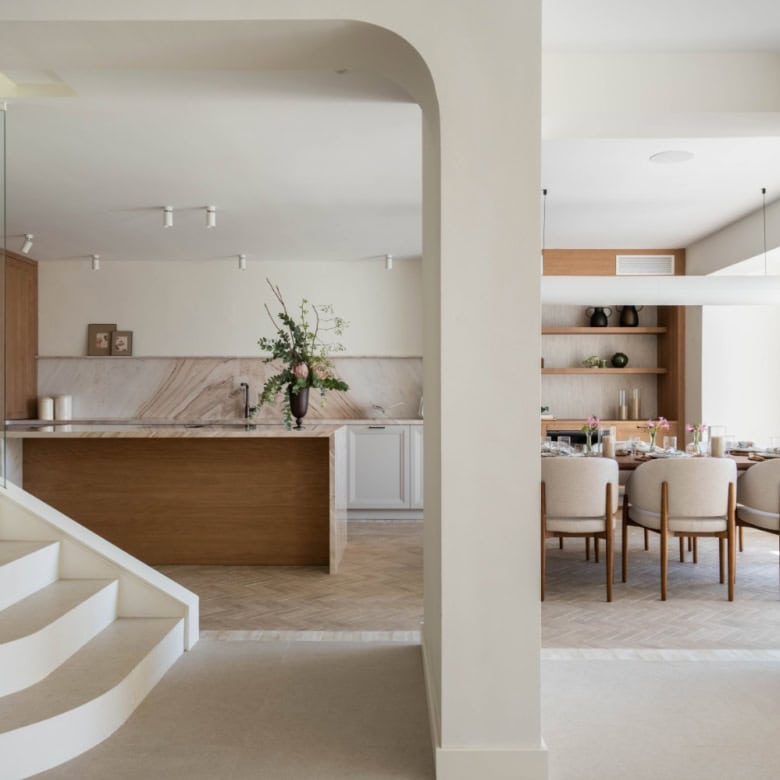 Modern Marbella beachfront home interior with open-plan living and dining area.