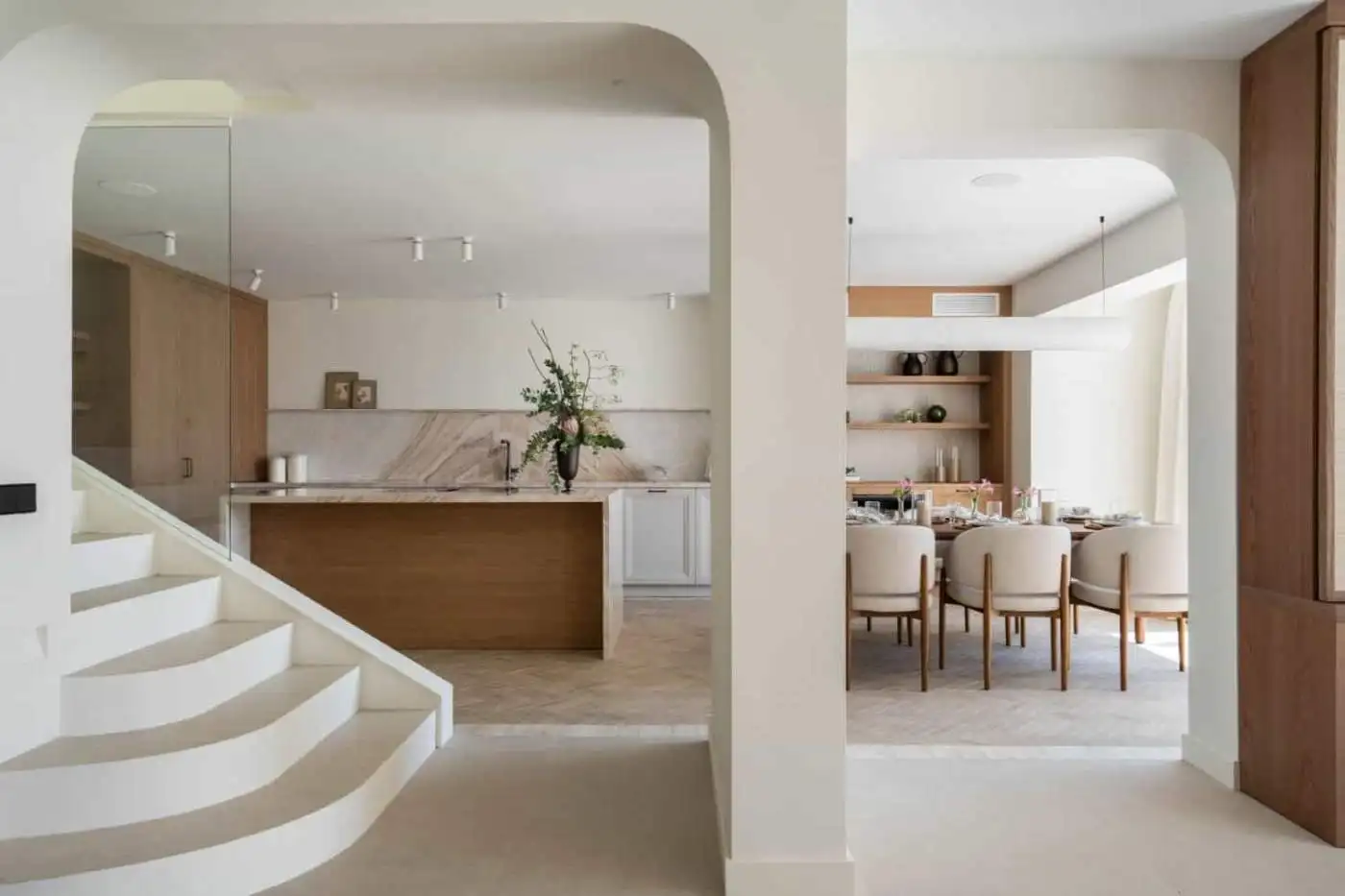 Modern Marbella beachfront home interior with open-plan living and dining area.