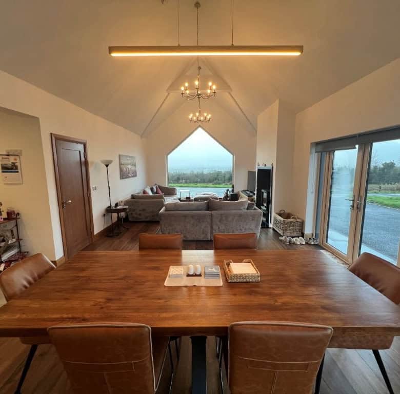 Spacious living area with panoramic views and modern decor at Derrymore Glen estate.