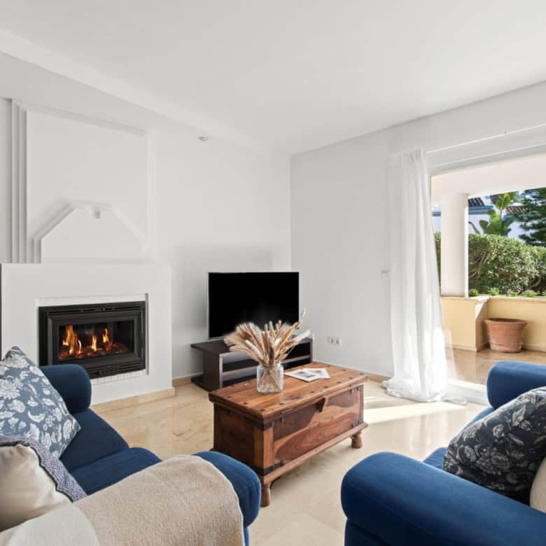 Beachfront living room with ocean views and modern decor.